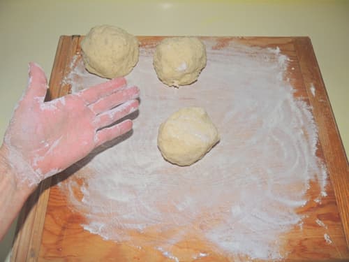 flour hands and work surface. Roll manageable dough balls to be further rolled into a tube of gnocchi