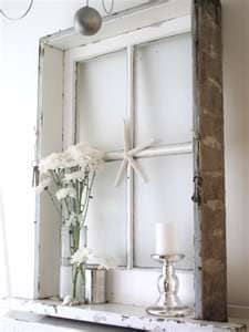 An old window still in the frame creates the perfect shadow box that can be filled with anything you find. It can be as simple as a basket of pine conss