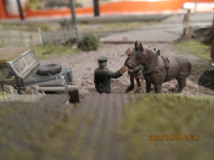 Looking down from the pigsty shed roof at the stationmaster and farmer (the blacksmith employed by the railway to shoe their delivery horses had a nice sideline!)