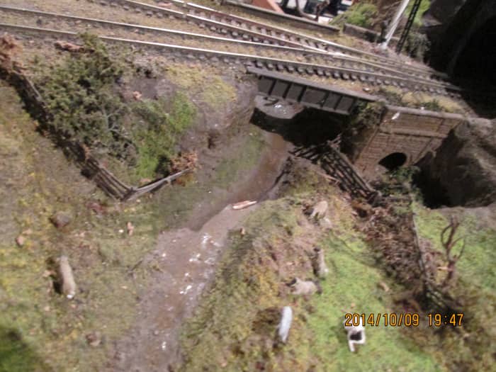 From the back of the layout, looking over the sheep grazing to the access bridge with its plate girder sides