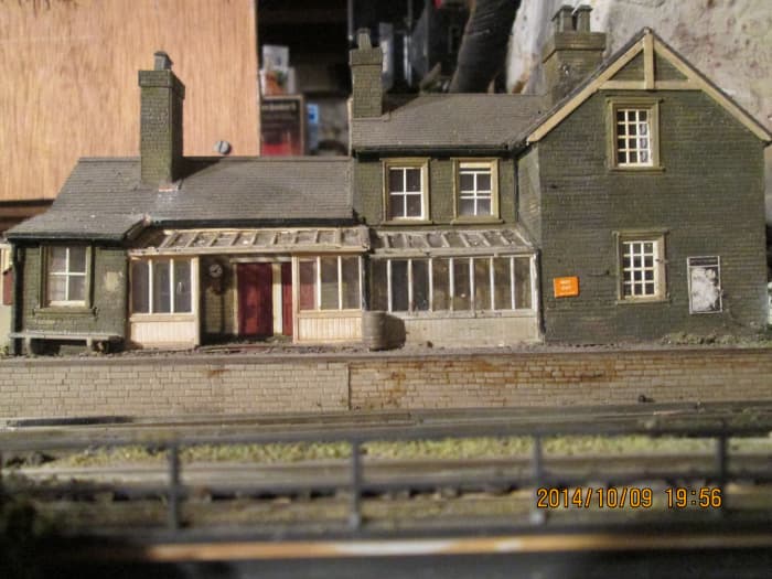 Seen straight on from the deck of the coal depot, the station frontage showing the porch modified from a Wills Greenhouse kit (behind which is the ticket office, ladies' room and general waiting room)
