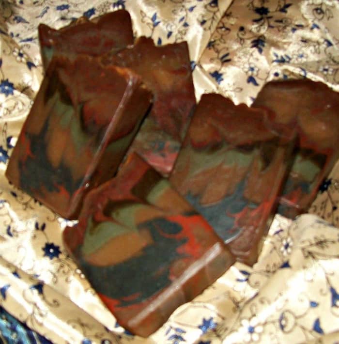 Here is the same Bastile recipe scented with Nag Champa and with several colors of soap poured in layers, followed by a "hanger swirl." This is a versatile recipe that colors and swirls beautifully.