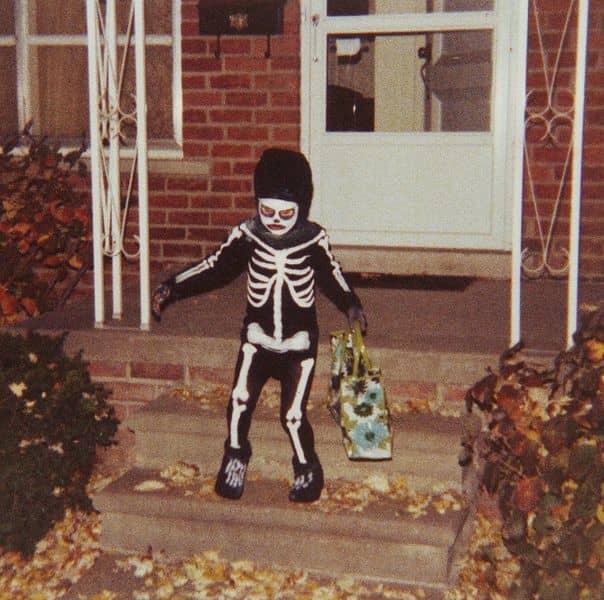 Small Trick or Treater in Spooky Costume Bears Away Spoils. This photo was taken in the US, but is reasonably typical of what might be seen in the UK .
