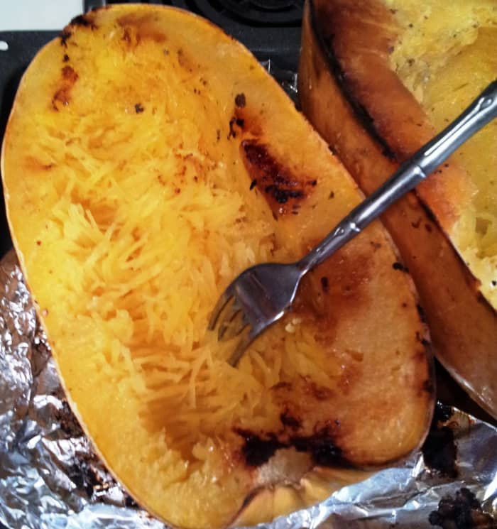 Pull a fork horizontally to achieve the best 'spaghetti' from your baked squash. Voila!