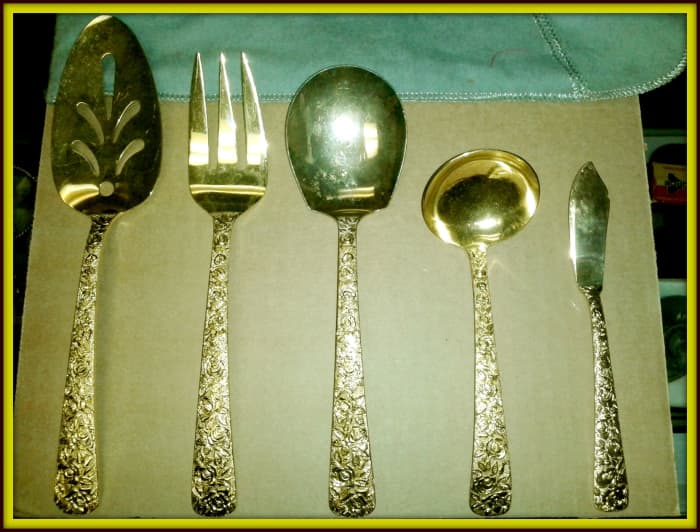 Cellini Romanesque Serving Set: This set includes Serving Fork, Server, Serving Spoon, Soup / Gravy Ladle, Butter Knife; they are stamped N.Y.M. Co., 1968.