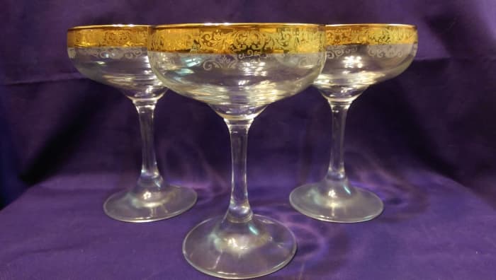 Here is a great example of three Cellini Crystal stemware Champagne glasses in 24 KT gold they were hand decorated Italy.