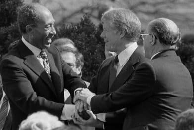Egyptian President Sadat, U.S. President Carter and Israel Prime Minister Begin Shake Hands after Signing the Israel/Egypt Peace Treaty in Washington D.C. on March 26, 1979