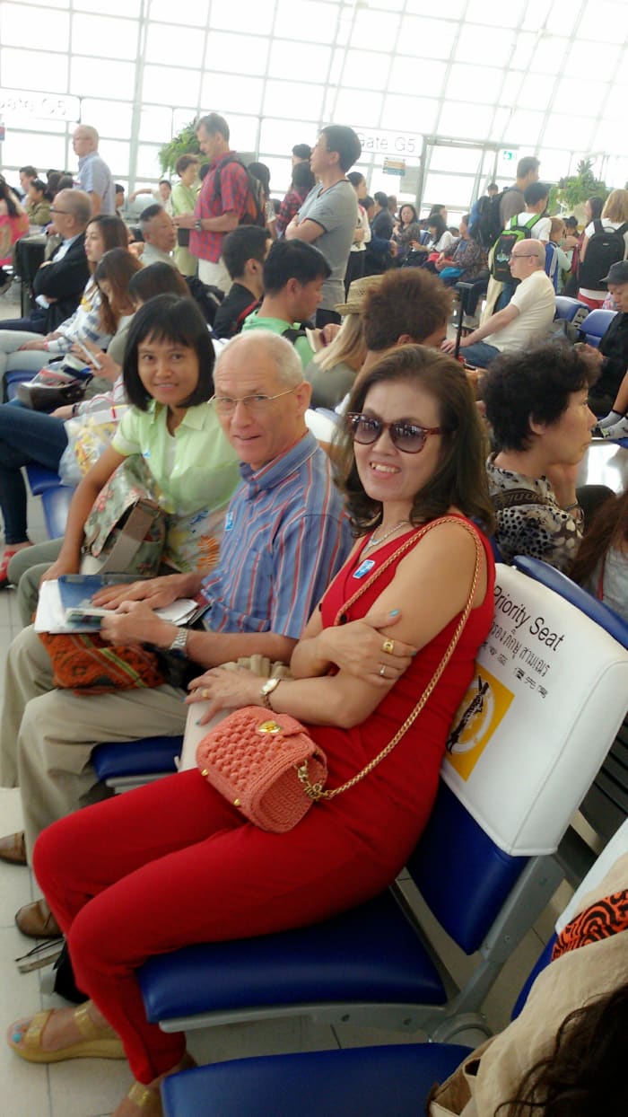 Taken at Udonthani Airport on 04-13-15. My wife is talking with my neighbor and his wife who accompanied us to Hong Kong.