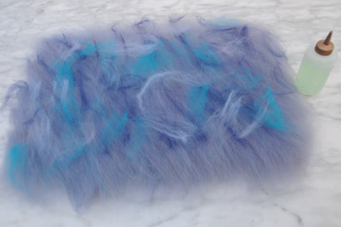Add a little decoration, use either contrasting wool fibers or silk fibers as shown here