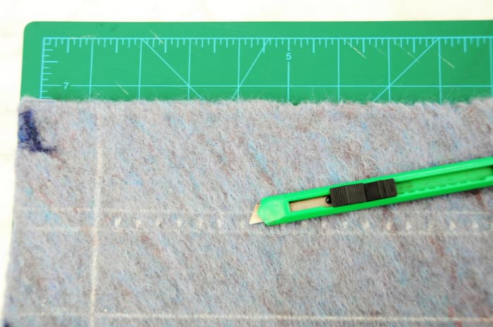 Supervise the cutting of felt with a blade cutter. A small sharp pair of nail scissors will do the job just as well