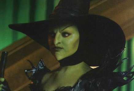 Mila Kunis dressed as Theodora, the Wicked Witch of the West