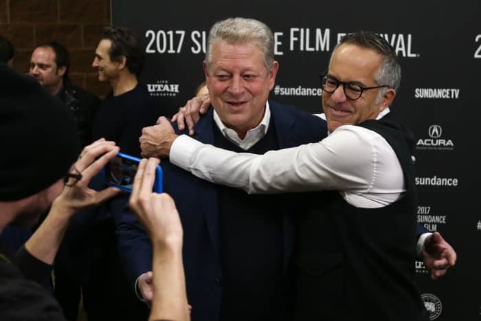 Festival director John Cooper embraced Al Gore at the premiere of the "An Inconvenient Truth" sequel presented at the 2017 Sundance Film Festival.