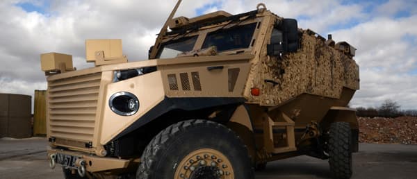 The current mode of armoured troop transport, a Foxhound PMV, painted for desert conditions