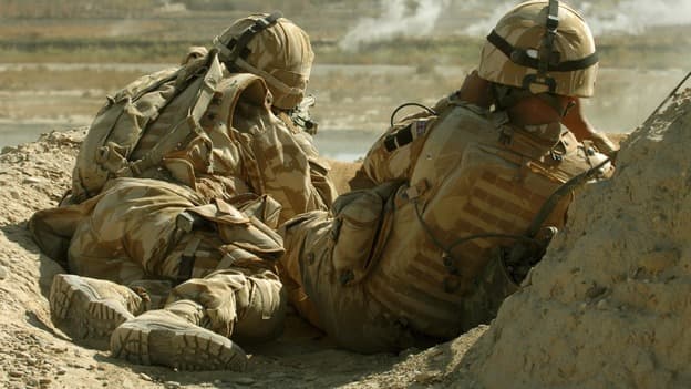 A British sniper and his spotter, like a secondman who verifies a hit. Conditions in Afghanistan demanded accurate spotting, as a miss betrayed the sniper's whereabouts