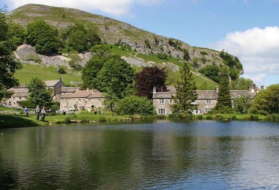 Kilnsey Village along the road to Skipton, with its overhanging crag. It's been like this since time immemorial, so who knows how much longer it'll last
