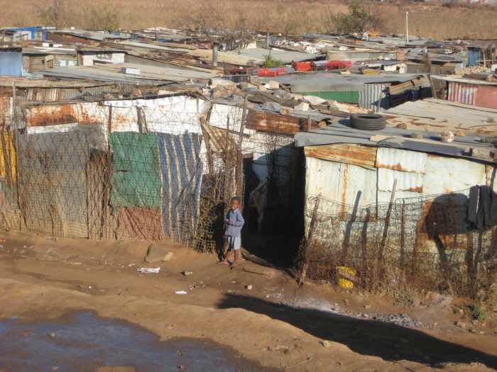 Matchbox houses composed from corrugated metal, scrap wood, cardboard, and sometimes cement similar to these shacks in the Kliptown community south of Johannesburg make up the hundreds of neglected squatter camps and informal settlements that more th