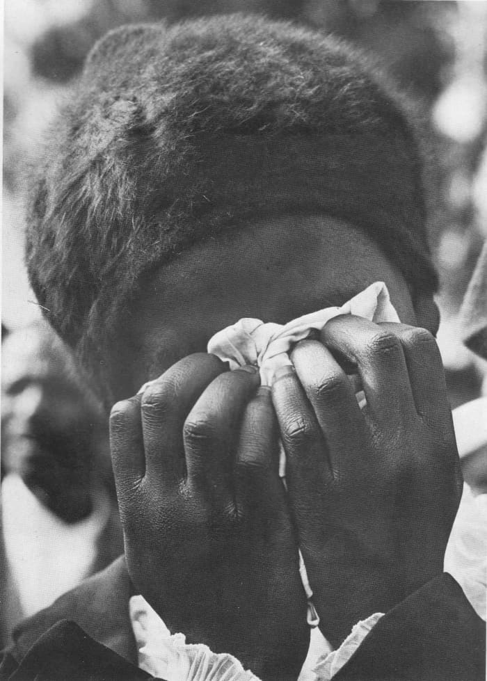 Cry The Beloved Peoples - woman mourner crying at one of the funerals of the 1976 police brutality and murder victims