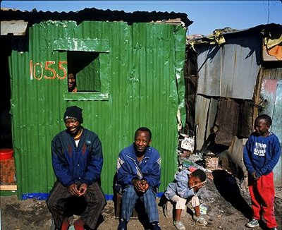 A carry-over of housing from the Apartheid era, still prevalent in today's South Africa. South African democracy was born in Chains.