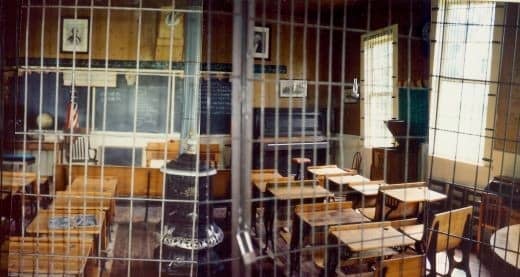 Partial view of the one-roomed Butler Township Schoolhouse #2 at Walnut Grove - (photos pieced together...windows were not crooked as this would suggest)