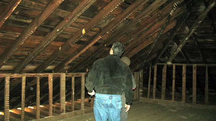 Third photo of John Crane and Jon Almada inspecting the wood used on the roof structure. It is original! Orb in this one is also between the lower upright structures.