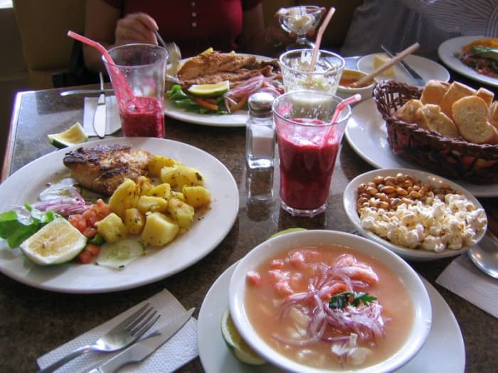 An Ecuadorean meal of soup, plato del dia, with the inevitable popcorn nibbles, and delicious juice!