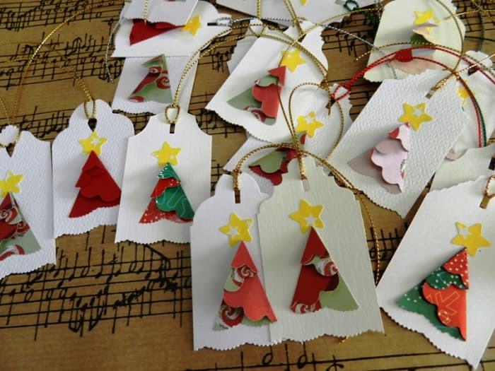 One circle from a small scalloped circle punch. Use fancy scissors to cut the slant on both sides of the top of the tag. Make enough tags to give away in future years.