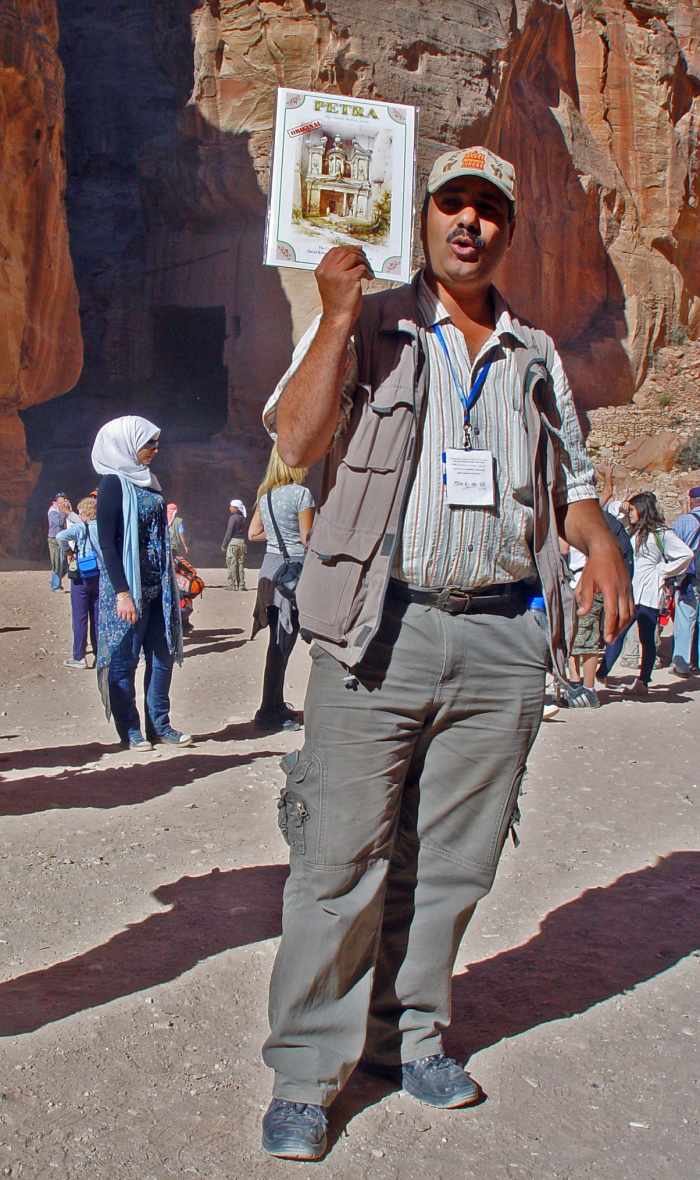 A tour guide in Jordan. A good guide must be easy to follow, both physically, informationally and visually. Concentration, training and practice makes perfect!