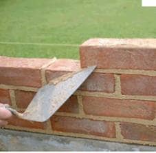 A brickies trowel showing hot to cut the mortar joint when laying bricks. The bricklayers use this trowel to spread the mortar tap the brick to the right position and many other things.
