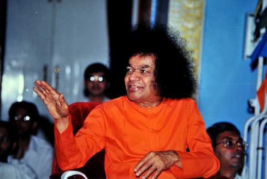 Blessing all the boys who had burst crackers and came to Him for little gifts of apples and sweets...