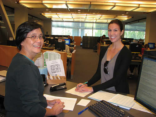 SJSU Librarian Helps Student in Reference - SJSU Librarian Helps Student at Reference Desk, 2nd floor King Library.