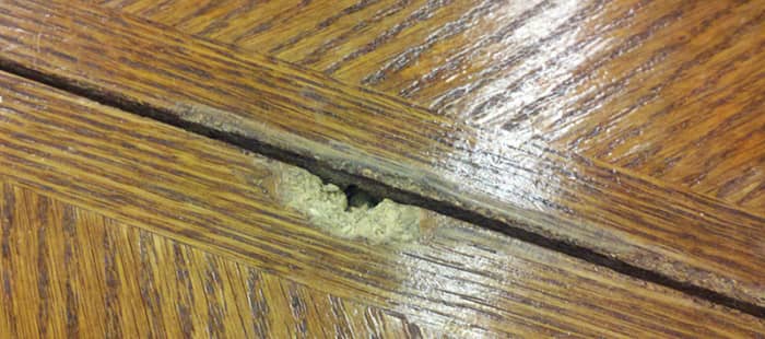 Table top insets made out of particle board also chip out leaving rough areas for fabric to snag on.