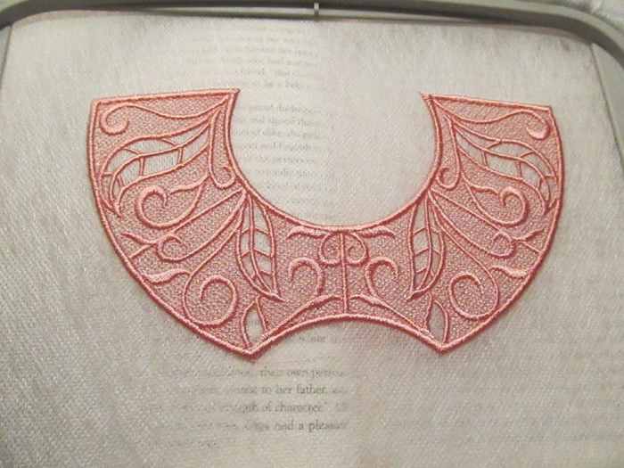 Stitch heavy design from Urban Threads (tricorne hat) done on two layers of Fabri-Solvy, one of the few times Badgemaster didn't save me.