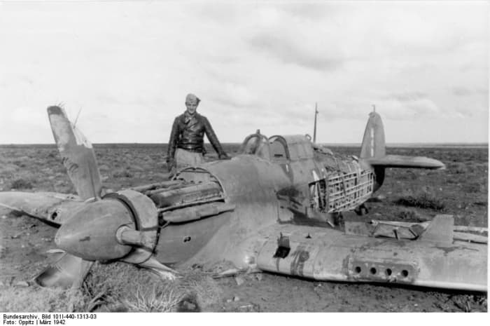 Marseille standing next to one of his victories. He would often return to the crash sites of planes he shot down and help survivors.
