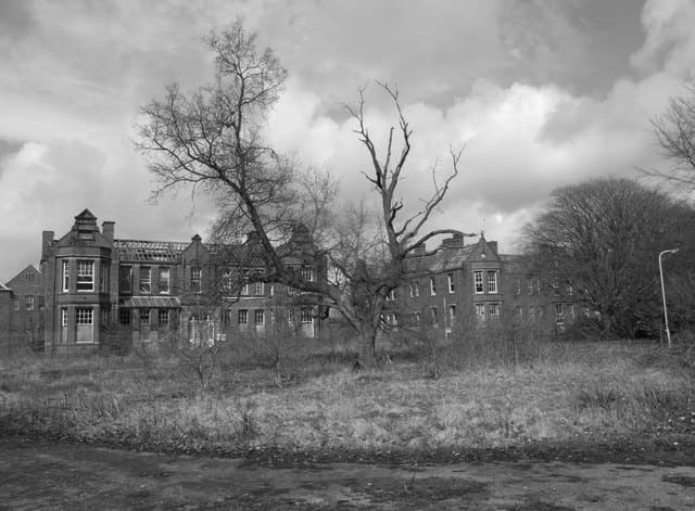 The roofless and decaying Cameron House Division at Whittingham Hospital, Lancashire, UK. Once the second largest mental asylum in Europe holding over 3000 patients. Copyright Saul Beeson and licensed for reuse under this Creative Commons Licence