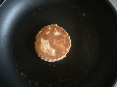 Cook the cakes on a lightly greased bakestone or heavy-bottomed frying pan (skillet) until they are golden brown on each side.