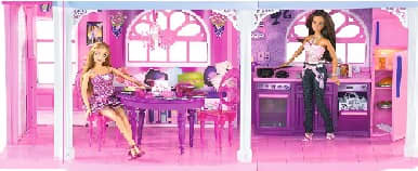 The kitchen and dining area of the Barbie 3-storey townhouse. Someone sitting at a table chatting, while waiting for a snack.
