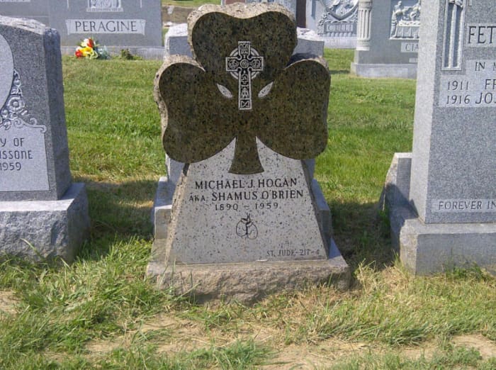 Donated Tombstone for Michael J. Hogan who fought as 'Yonkers Favorite' Shamus O'Brien. The green tombstone is in the shape of a shamrock and features a Celtic Cross and a pair of boxing gloves. His grave is located in St. Joseph Cemetery in Yonkers,