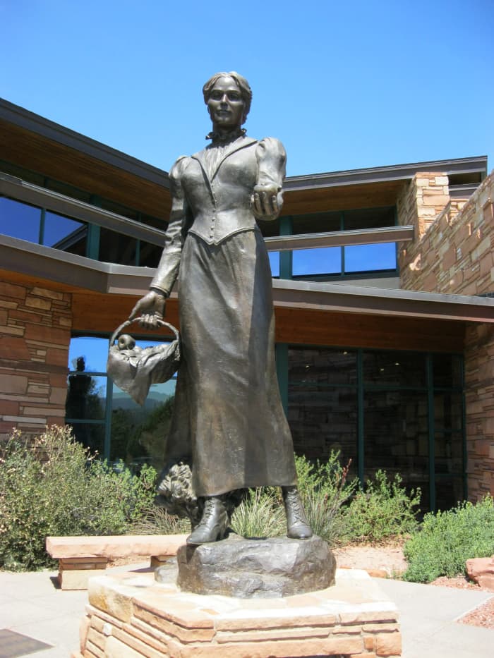 Bronze Sculpture of Sedona Schnebly by artist Susan Kliewer in front of Sedona's Library