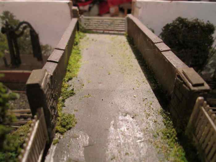 The view across the bridge - Wills' girder sections either side, road is wet & dry fine sandpaper, Ratio fencing and goods depot gate (far end)