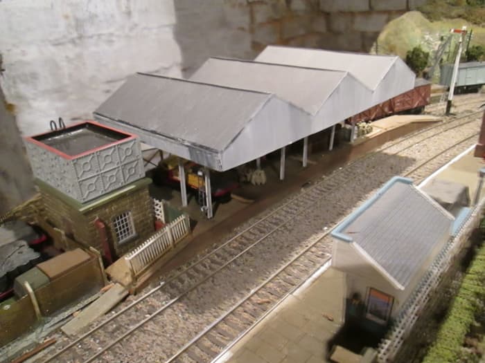 Goods depot roof was bought assembled. Pillars, side awnings and laddering applied to fit the location. The water tower and platform shelter are from Hornby's Skaledale range based on Goathland on the NYMR