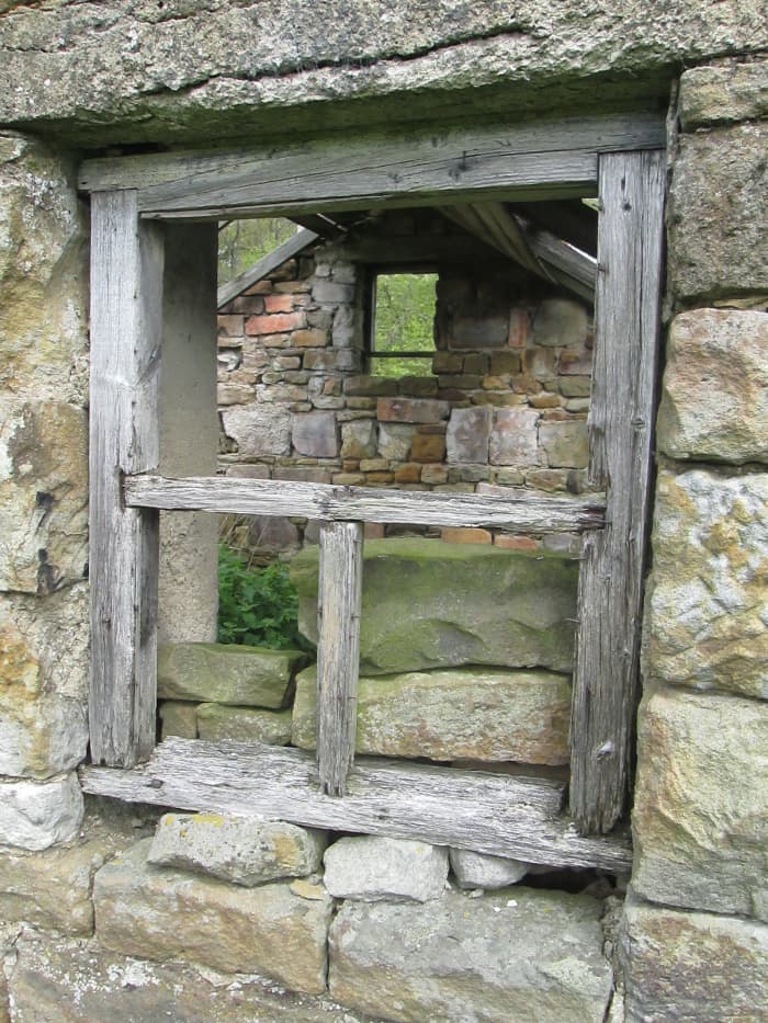 It doesn't look as if there was ever anywhere to put feed and the doorway's too narrow or low to lead animals such as ponies