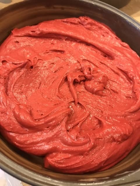 Transfer the batter to the prepared cake pans, and smooth the tops with a rubber spatula. This helps the cakes rise evenly.