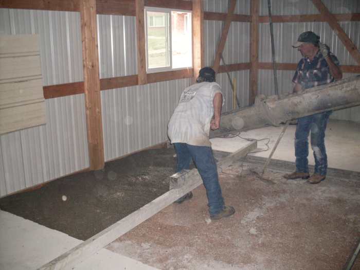We had covered the window nearest the chute with a piece of sheet metal, in case of accidents in handling the chute or other equipment. That is a power screed lying across the section.