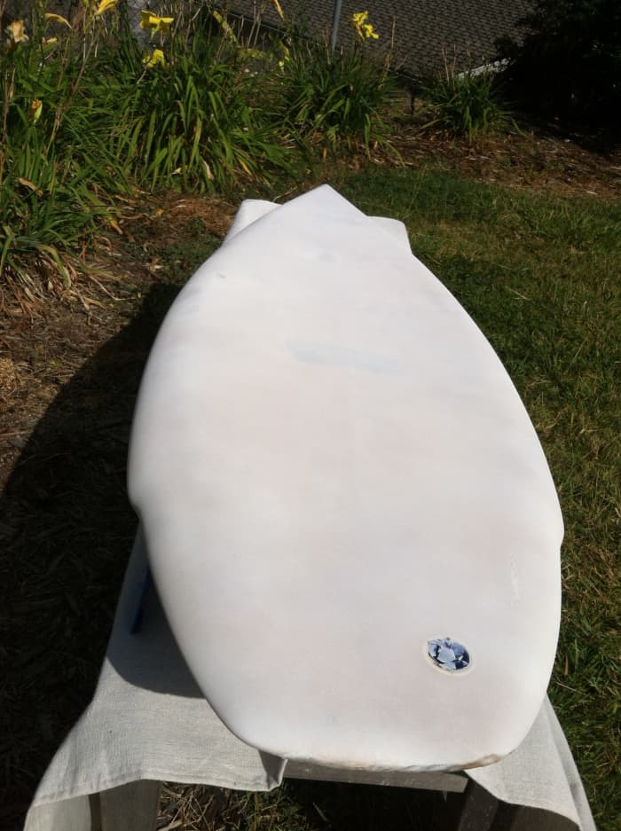 Primed board. I used two full cans of primer to cover front and back of the board. After a couple days, the stains started showing through at certain places.