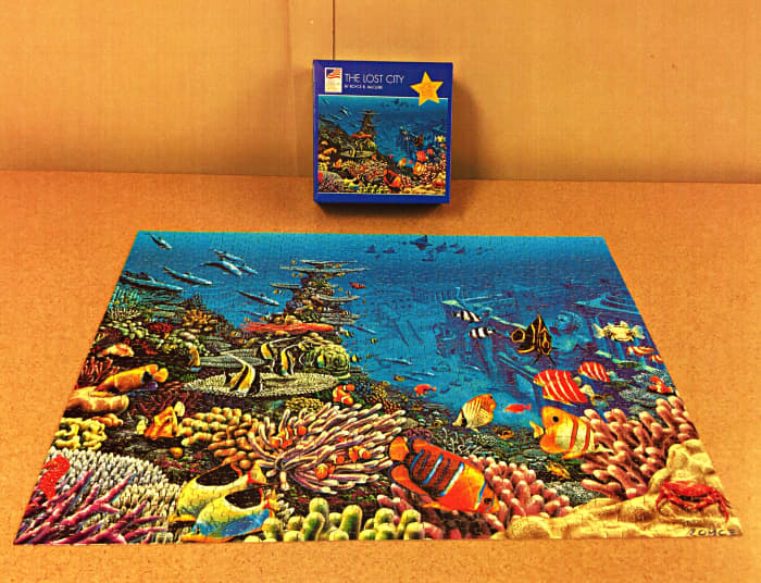 The Lost City by Royce B. McClure ... over 1,000 pieces ... Size 19 1/4" x 26 5/8" made by the Great American Puzzle Factory. Definitely a challenge but worth every minute. It has the most unique pieces I've seen so far.