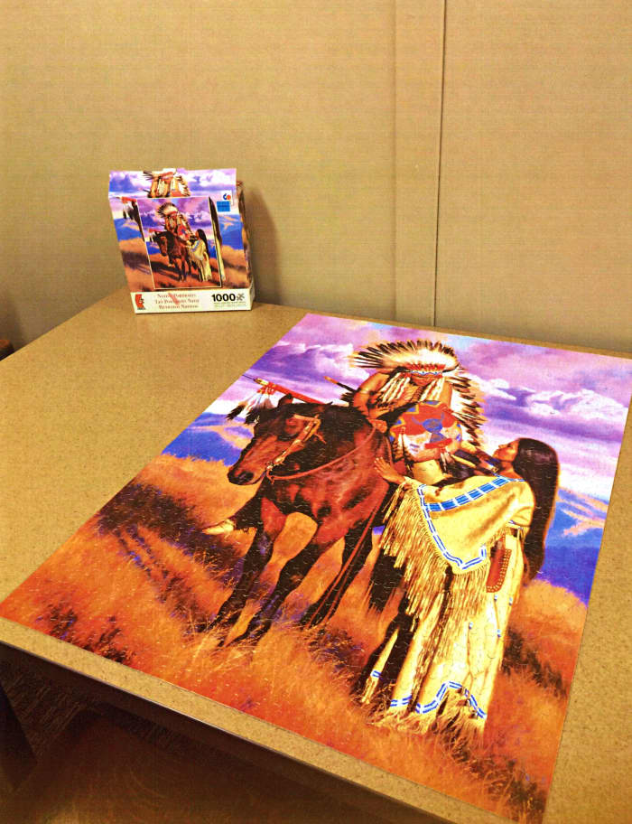 Lovely American Indian Jigsaw Puzzle made by Ceaco, The Farewell (Native Portraits) The Farewell is part of the Native American portrait 1000 piece jigsaw puzzle series by artist Alfredo Rodriguez. Puzzle measures 20" x 27" completed.