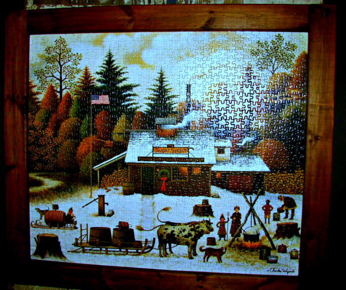 Here is an amazing finished piece of jigsaw puzzle art by Charles Wysocki. It is a awesome primitive folk art piece that is both Americana and Christmas all together in one fantastic scene.
