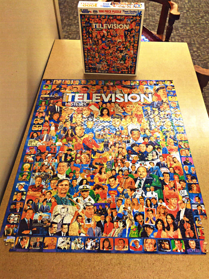 Beautiful Television Puzzle 1000 Pieces, and almost finished. Made by White Mountain, and the theme is: Television History.