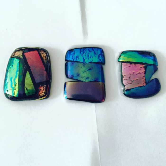 These are among the very first pendants I made in my microwave kiln! As you can see, they're very simple: just pieces of glass laid of against black or white backgrounds (base glass).