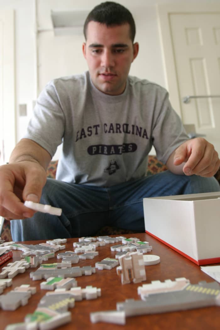 This wounded army veteran took brain injury in while serving his country. He helps his to improve his hand/eye coordination and memory by playing video games and piecing together puzzles, like this 3D puzzle of the White House.